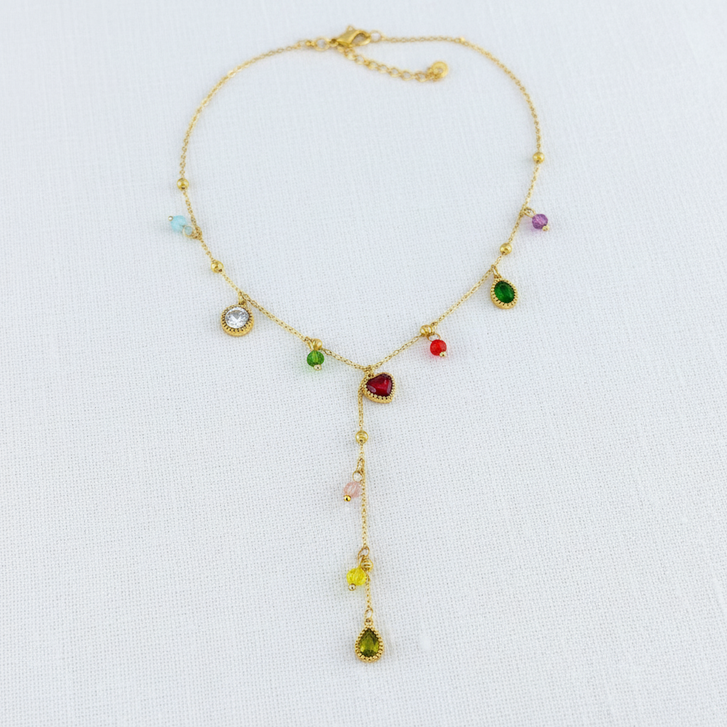 Gold star necklace on white linen background