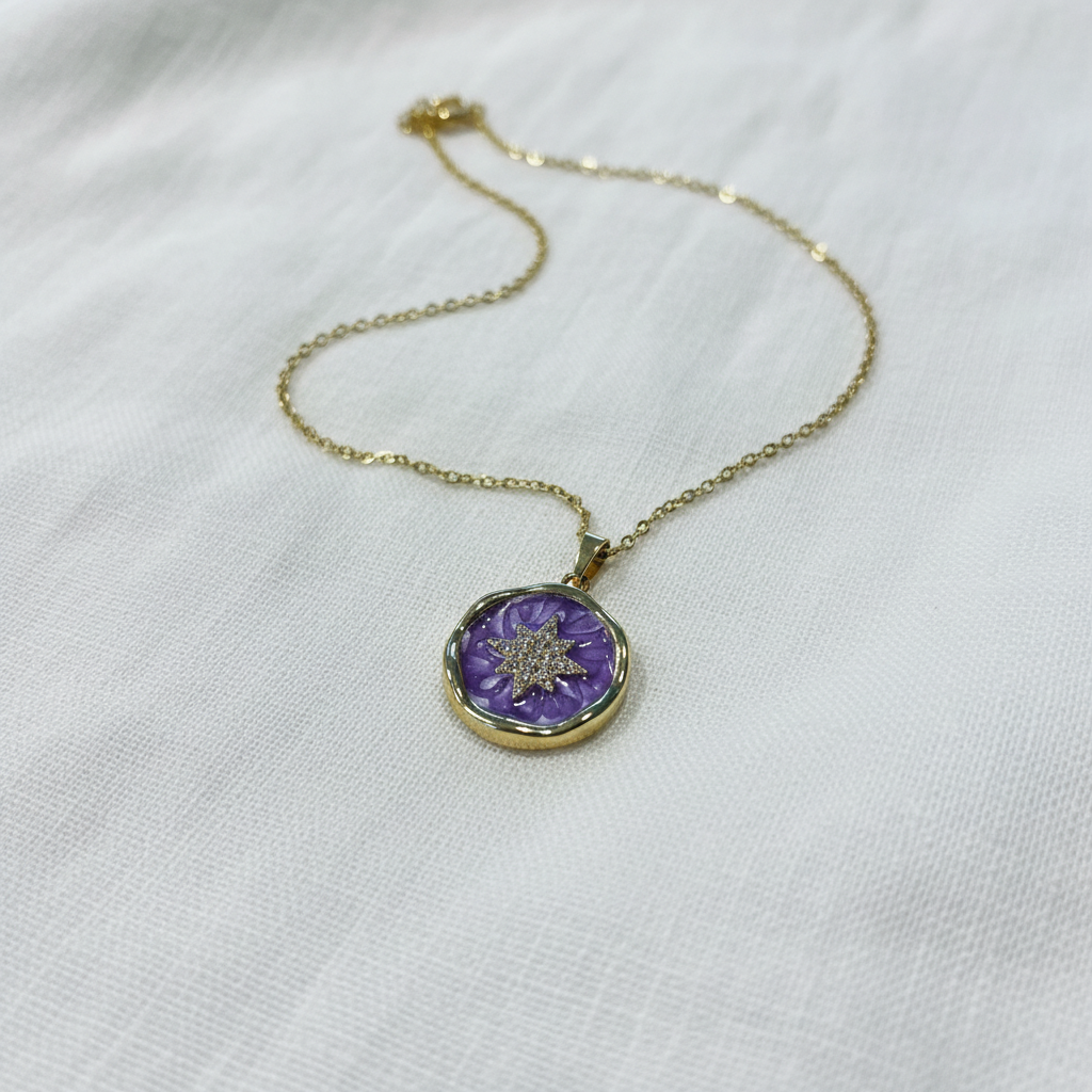 Purple celestial necklace on white linen