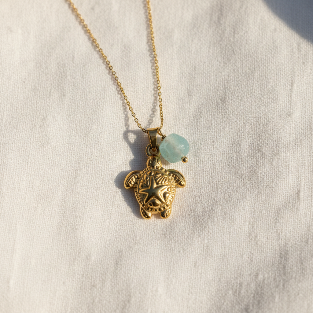 Sea turtle pendant close-up on white linen