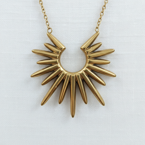 Sunburst pendant close-up on white linen