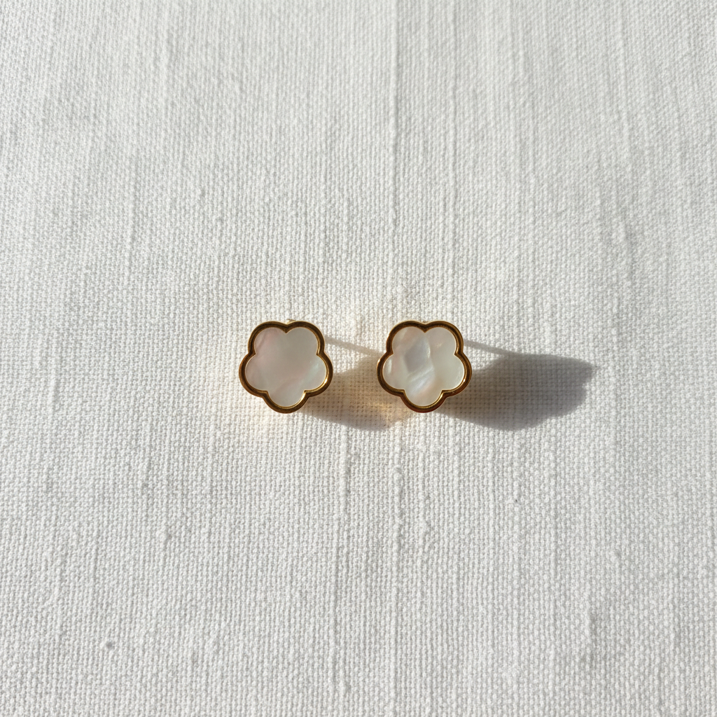 White mother-of-pearl clover earrings close-up