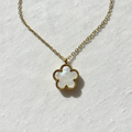 White mother-of-pearl clover pendant close-up